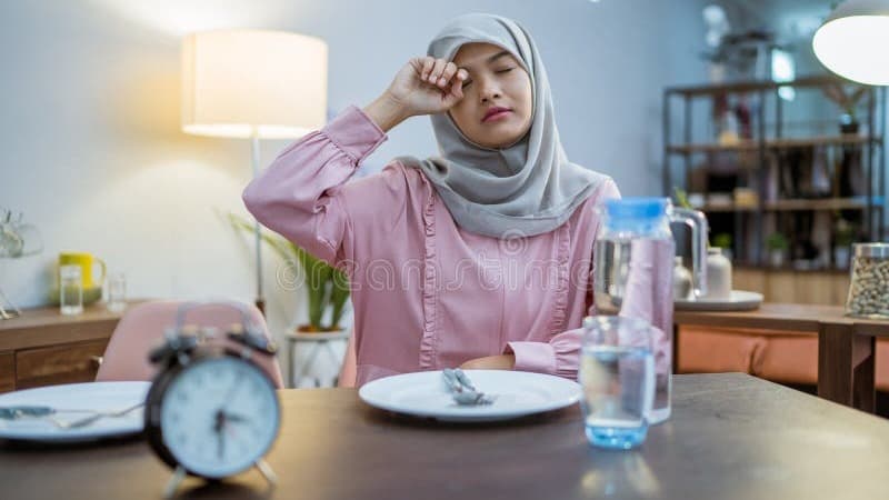 tired-woman-having-break-fast-sahur-morning-muslim-wake-up-early-to-have-breakfast-fasting-month-concept-ramadan-252937910.jpg